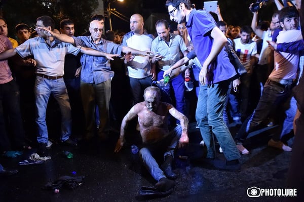 On the 14th day of the occupation of Patrol-Guard Service Regiment of Erebuni district by 'Sasna Tsrer' group, protesting people marched to Baghramyan Avenue in Yerevan, Armenia. One of the protesters set himself on fire